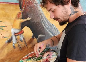 Artist create painting of bull